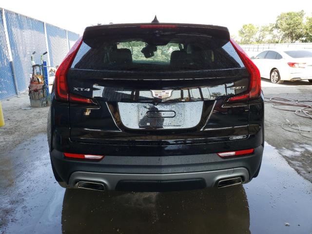 1GYFZCR42MF033909 - 2021 CADILLAC XT4 PREMIUM LUXURY BLACK photo 6