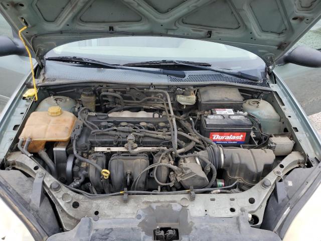 1FAFP34N25W278664 - 2005 FORD FOCUS ZX4 GREEN photo 11