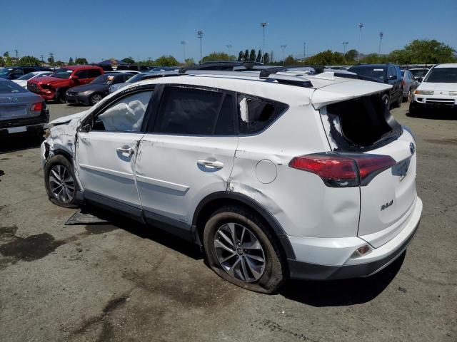 JTMRJREV0GD033872 - 2016 TOYOTA RAV4 HV XLE WHITE photo 2