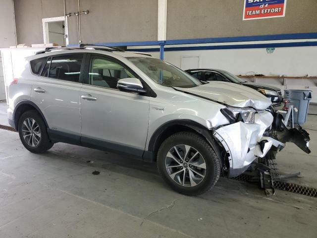 JTMRJREV3GD042971 - 2016 TOYOTA RAV4 HV XLE SILVER photo 4