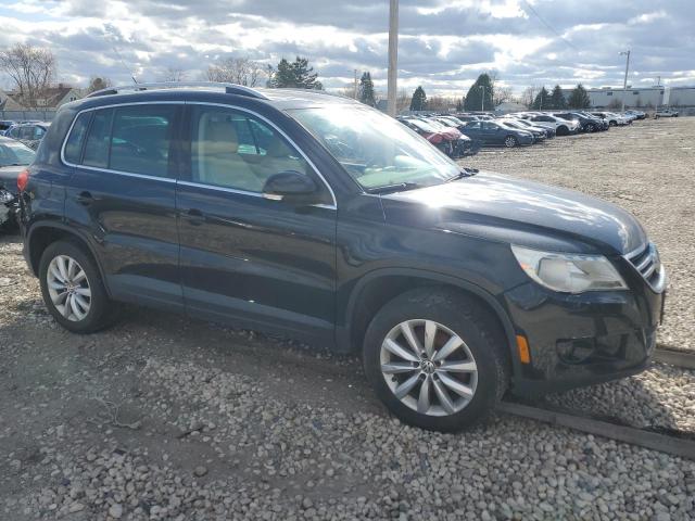 WVGBV7AX3BW553512 - 2011 VOLKSWAGEN TIGUAN S BLACK photo 4