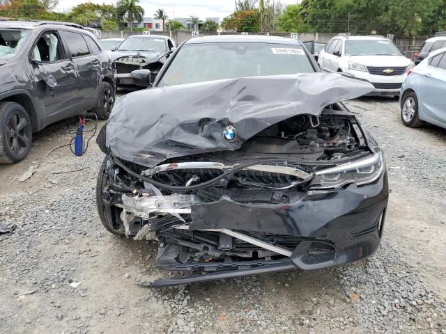 3MW5R7J09M8C00984 - 2021 BMW 330XI Schwarz Foto 5