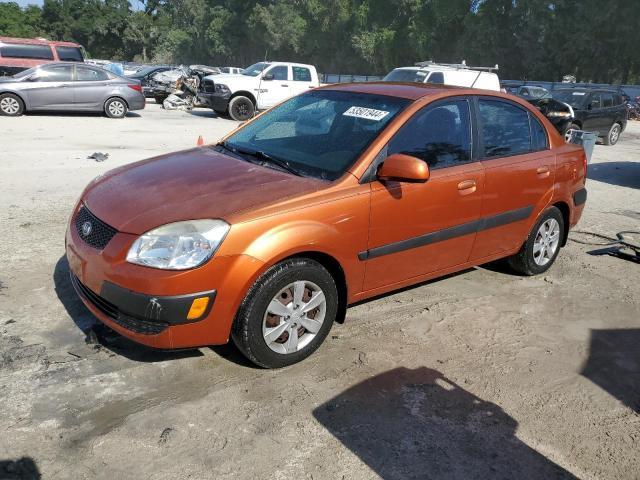 KNADE223996576103 - 2009 KIA RIO BASE ORANGE photo 1