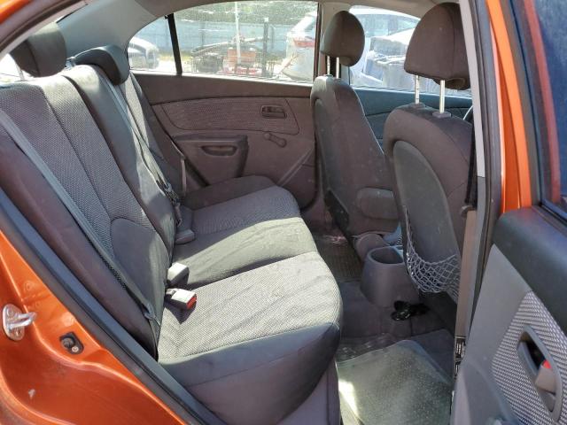 KNADE223996576103 - 2009 KIA RIO BASE ORANGE photo 10