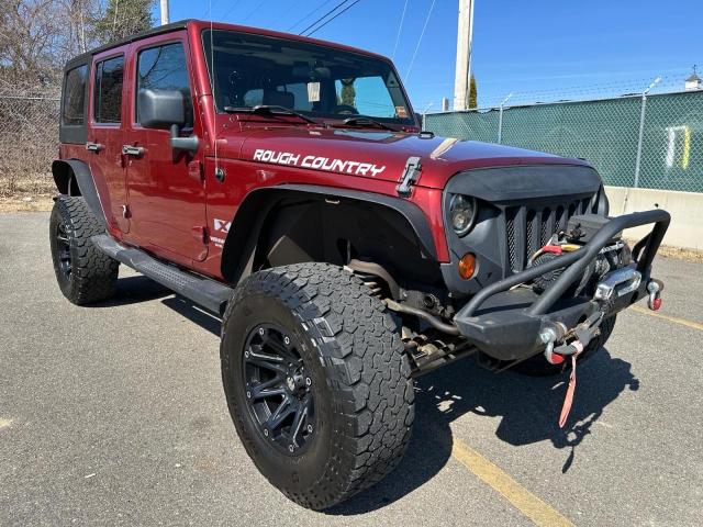 1J4GA39139L763421 - 2009 JEEP WRANGLER U X BURGUNDY photo 1