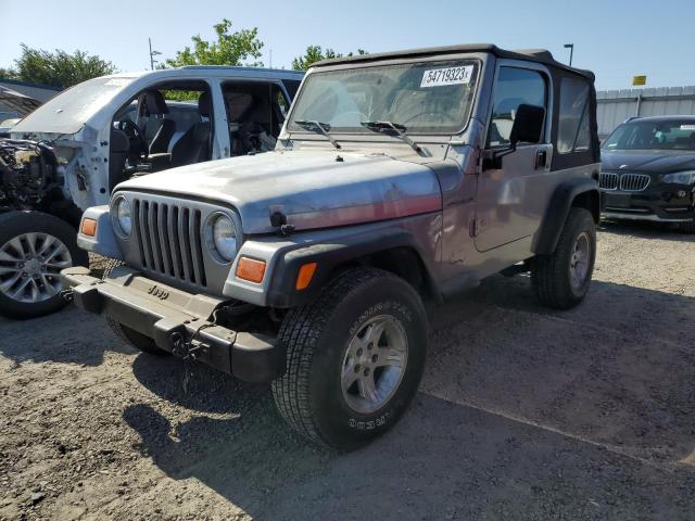 1J4FA49S4YP720899 - 2000 JEEP WRANGLER / SPORT GRAY photo 1