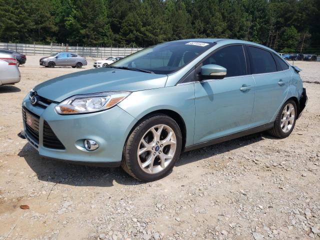 1FAHP3H27CL389850 - 2012 FORD FOCUS SEL TURQUOISE photo 1