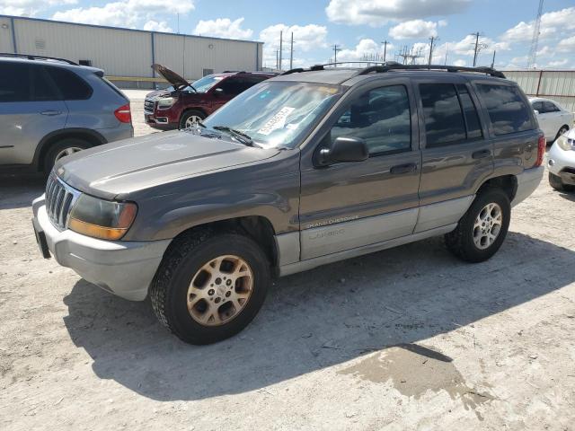 1J4G258S7XC668554 - 1999 JEEP GRAND CHER LAREDO TAN photo 1