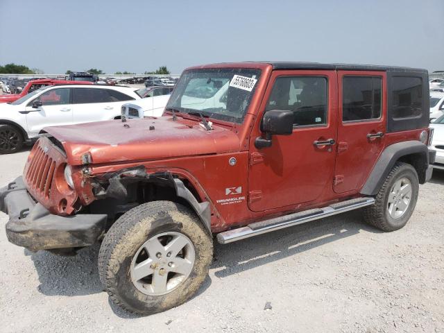 1J4GA39199L711873 - 2009 JEEP WRANGLER U X ORANGE photo 1