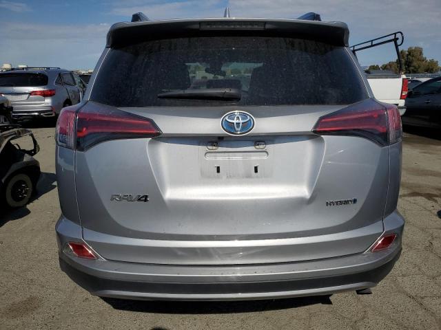 JTMRJREV6JD225658 - 2018 TOYOTA RAV4 HV LE SILVER photo 6