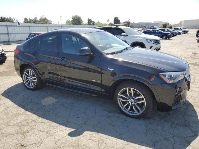 5UXXW5C50F0E88345 - 2015 BMW X4 XDRIVE35I BLACK photo 4