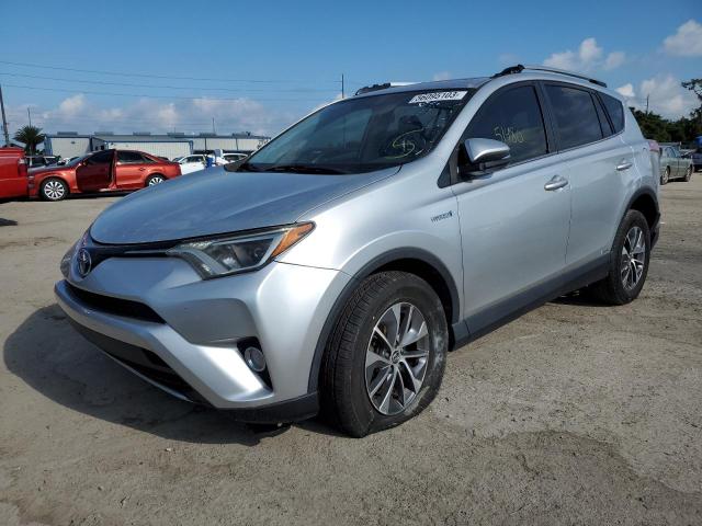 JTMRJREV8GD037264 - 2016 TOYOTA RAV4 HV XLE SILVER photo 1