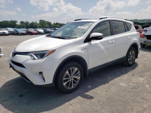 JTMRJREV4GD027296 - 2016 TOYOTA RAV4 HV XLE WHITE photo 1