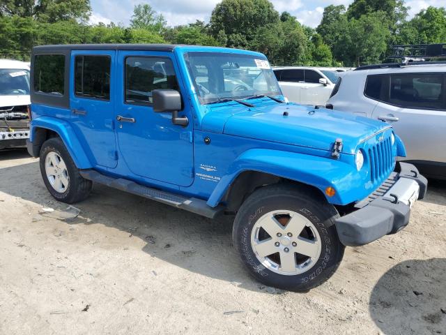 1J4HA5H17BL600360 - 2011 JEEP WRANGLER U SAHARA BLUE photo 4