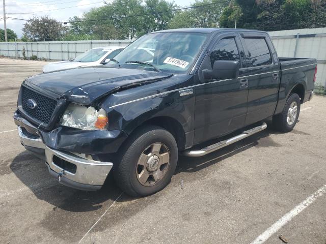 1FTPW12574KD00933 - 2004 FORD F150 SUPERCREW BLACK photo 1