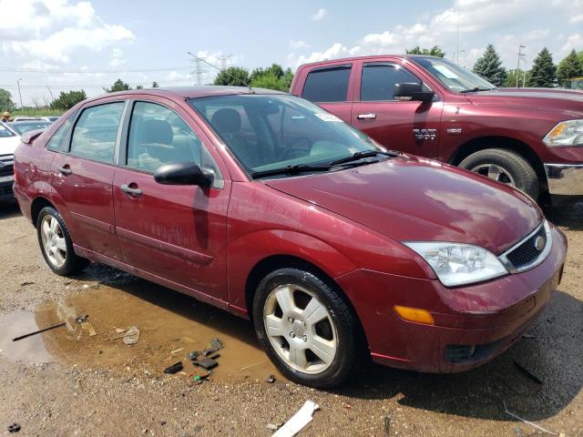 1FAHP34NX7W180283 - 2007 FORD FOCUS ZX4 BURGUNDY photo 4