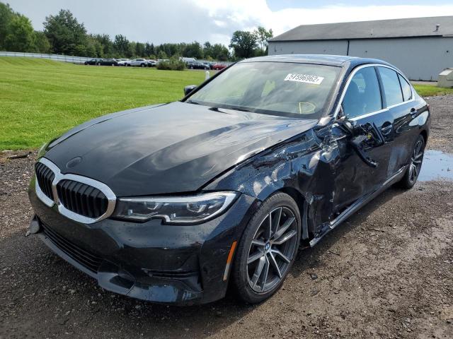 WBA5R7C50KAJ79808 - 2019 BMW 330XI Schwarz Foto 2