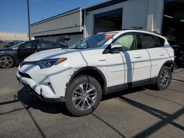 JTMRJREVXJD254628 - 2018 TOYOTA RAV4 HV LE WHITE photo 1