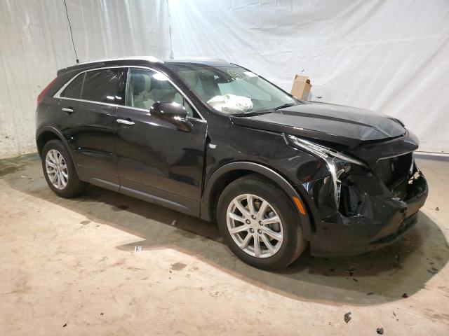 1GYFZBR40PF104376 - 2023 CADILLAC XT4 LUXURY BLACK photo 4