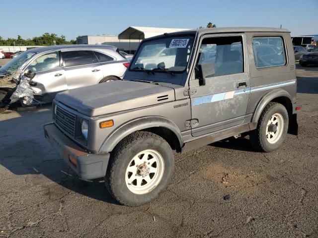 JS4JC51V8H4133724 - 1987 SUZUKI SAMURAI GRAY photo 1