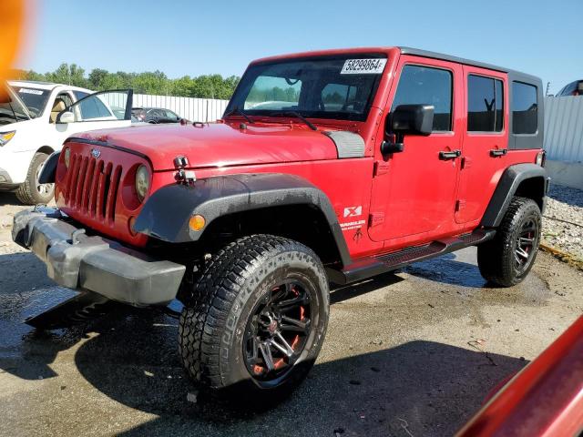 1J4GA39149L768868 - 2009 JEEP WRANGLER U X RED photo 1