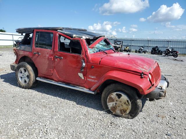 1J4BA5H17BL500863 - 2011 JEEP WRANGLER U SAHARA RED photo 4