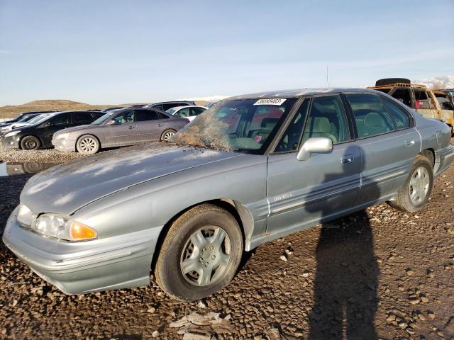 1G2HX52K1T4216810 - 1996 PONTIAC BONNEVILLE SE GRAY photo 1