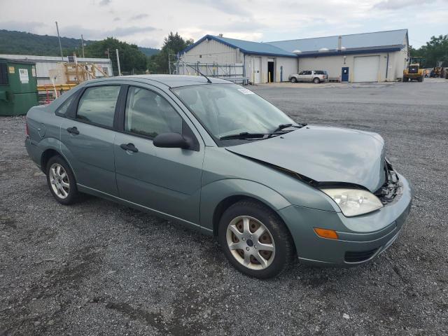 1FAFP34N35W262375 - 2005 FORD FOCUS ZX4 GREEN photo 4