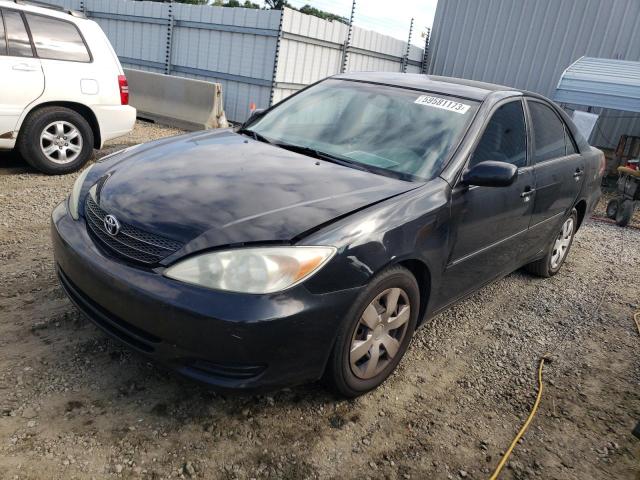 4T1BE32KX2U571450 - 2002 TOYOTA CAMRY LE/X LE BLACK photo 1