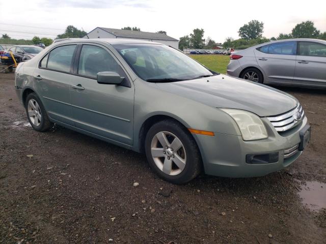 3FAHP07Z59R140731 - 2009 FORD FUSION SE GREEN photo 4