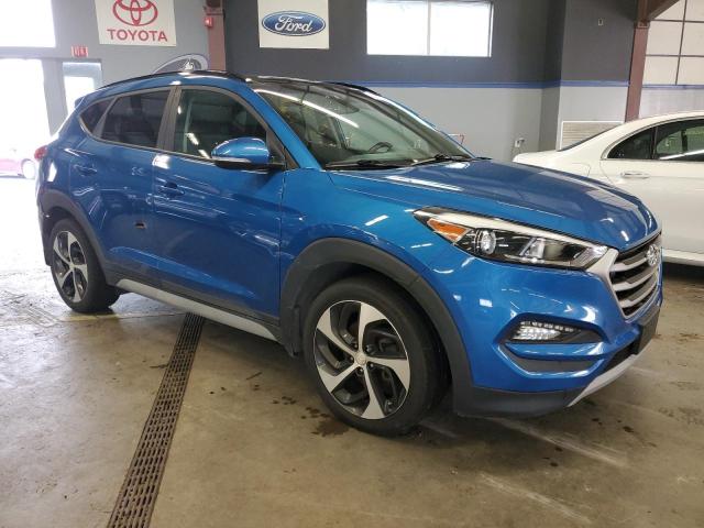 KM8J3CA23JU824688 - 2018 HYUNDAI TUCSON VALUE BLUE photo 4