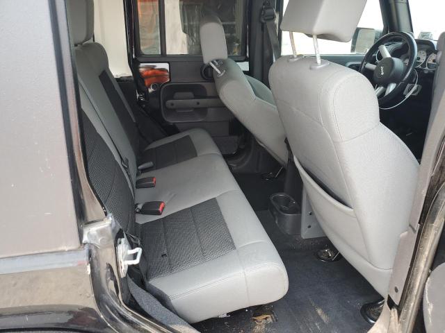 1J4BA5H1XAL115764 - 2010 JEEP WRANGLER U SAHARA BLACK photo 11