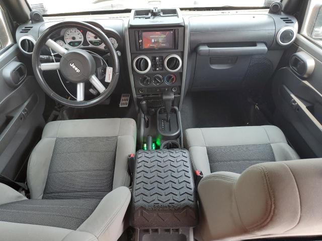 1J4BA5H1XAL115764 - 2010 JEEP WRANGLER U SAHARA BLACK photo 8