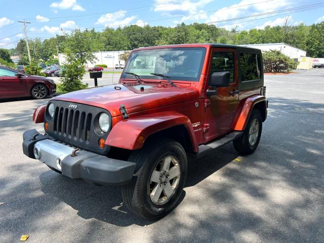 1J4FA541X9L738904 - 2009 JEEP WRANGLER SAHARA ORANGE photo 2