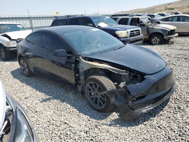 5YJ3E1EA7PF585063 - 2023 TESLA MODEL 3 BLACK photo 4