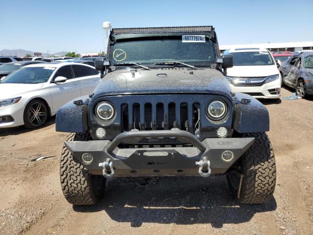 1C4BJWEG3EL106480 - 2014 JEEP WRANGLER U SAHARA BLACK photo 5