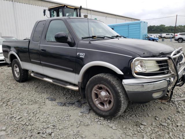 1FTRX18W82NA31729 - 2002 FORD F150 Schwarz Foto 4
