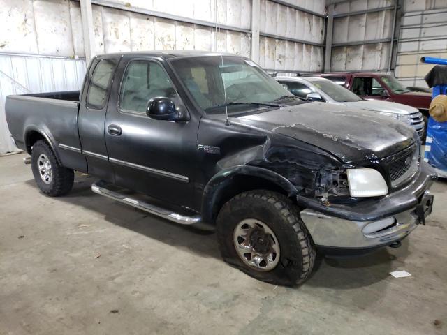 1FTFX28L6VKD26932 - 1997 FORD F250 BLACK photo 4