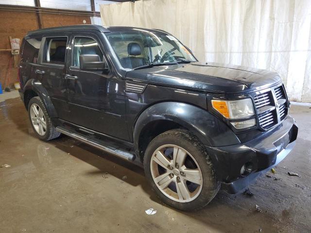 1D4PU4GX4BW607082 - 2011 DODGE NITRO HEAT BLACK photo 4