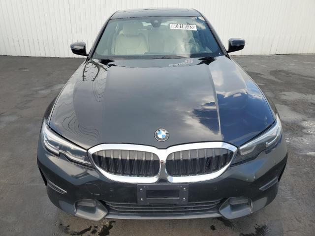 3MW5R7J06M8C12011 - 2021 BMW 330XI BLACK photo 5