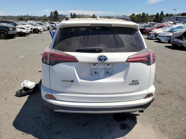 JTMRJREV5JD210780 - 2018 TOYOTA RAV4 HV LE WHITE photo 6