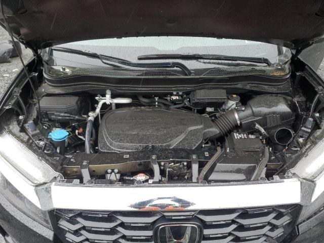 5FNYF8H55PB022183 - 2023 HONDA PASSPORT EXL შავი ფოტო 12