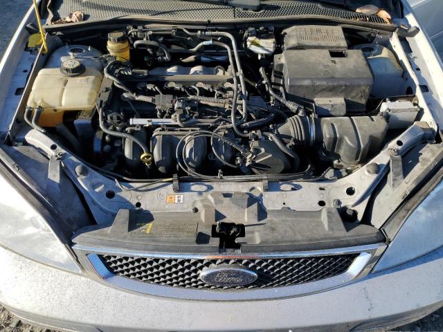 1FAFP34N55W310961 - 2005 FORD FOCUS ZX4 SILVER photo 11