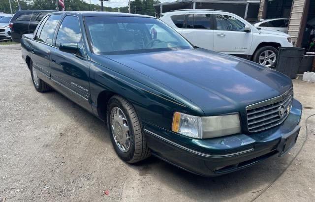 1G6KF5290VU224825 - 1997 CADILLAC DEVILLE CONCOURS GREEN photo 1