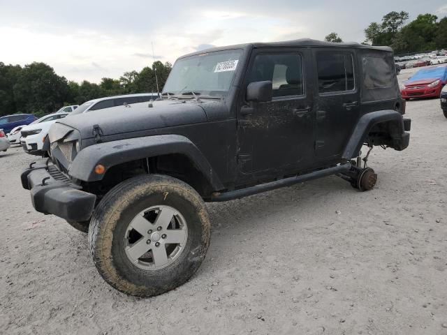 1C4HJWEG2CL128316 - 2012 JEEP WRANGLER UNLIMITED SAHARA შავი ფოტო 1