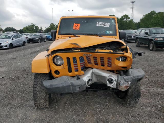 1C4BJWEGXCL122706 - 2012 JEEP WRANGLER U SAHARA ORANGE photo 5