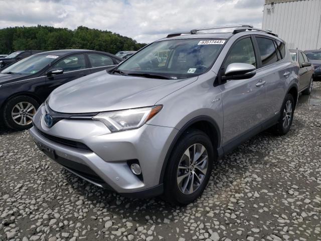 JTMRJREV6JD213915 - 2018 TOYOTA RAV4 HV LE SILVER photo 1