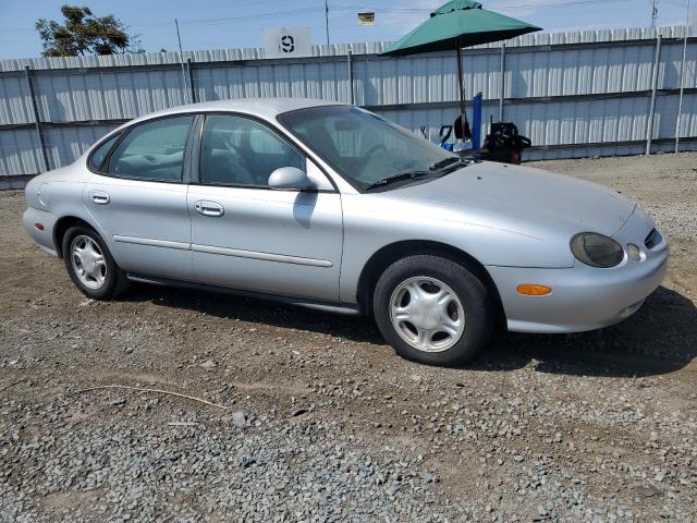 1FAFP53U6XG153295 - 1999 FORD TAURUS SE SILVER photo 4