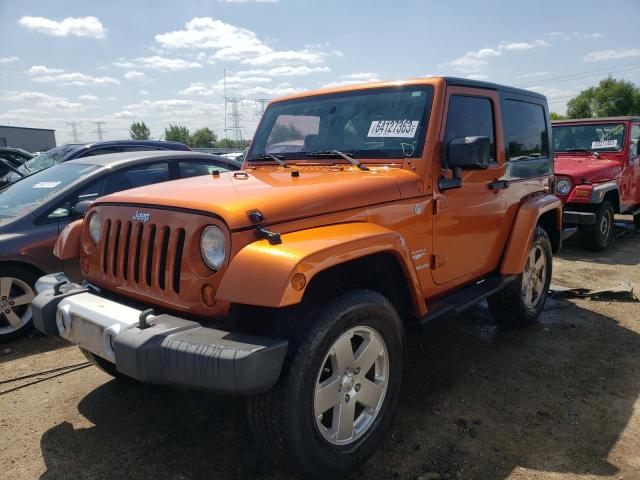 1J4AA5D11AL192024 - 2010 JEEP WRANGLER SAHARA ORANGE photo 1