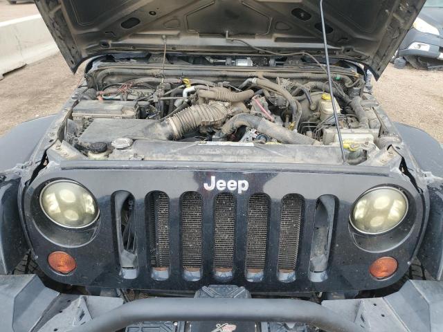 1J4HA5H11BL508712 - 2011 JEEP WRANGLER U SAHARA შავი ფოტო 12